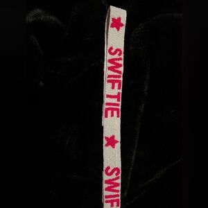 Pink “SWIFTIE” bag strap